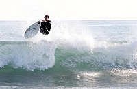 Mezak riding a wave.